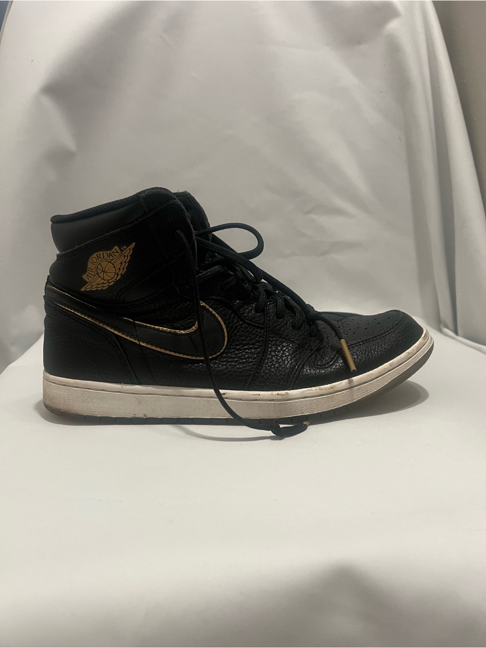 Jordan Black Athletic Sneakers with Gold Accents